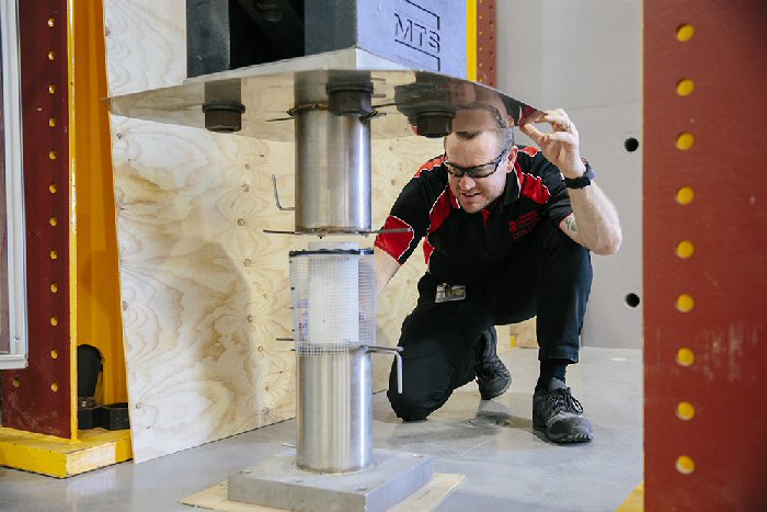 Workshop staff checking equipment